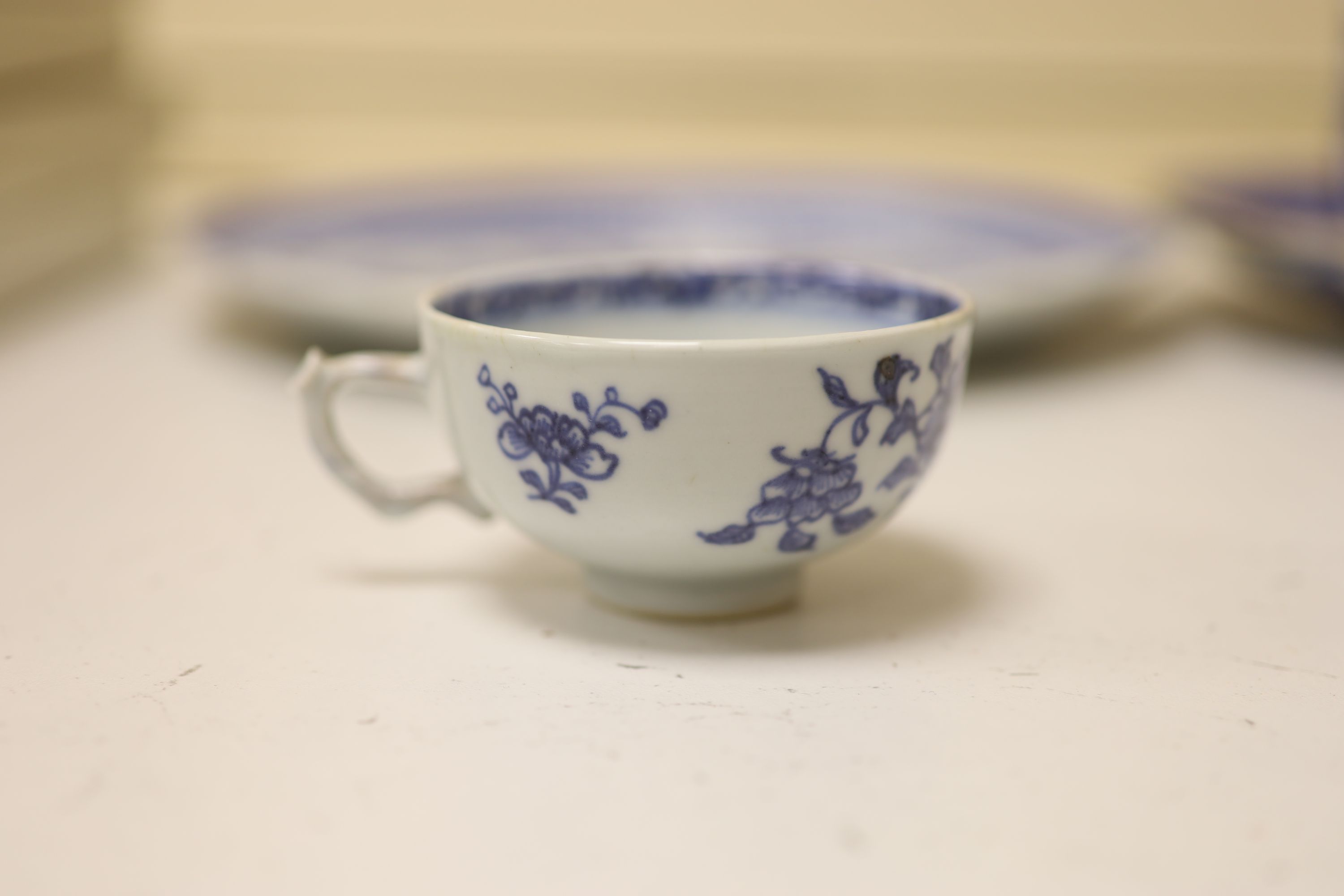 An 18th century Chinese blue and white mug and cup, a 19th century Chinese blue and white plate and a Japanese plate